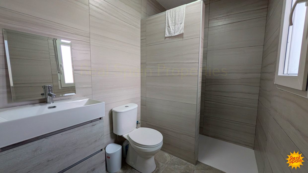 Bathroom at Cortijo Salud with bath, shower screen, toilet and basin