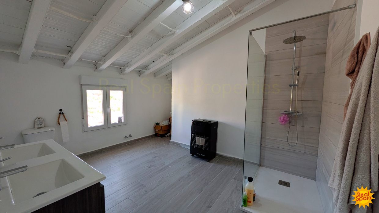 Bathroom at Cortijo Salud with shower enclosure, basin and toilet
